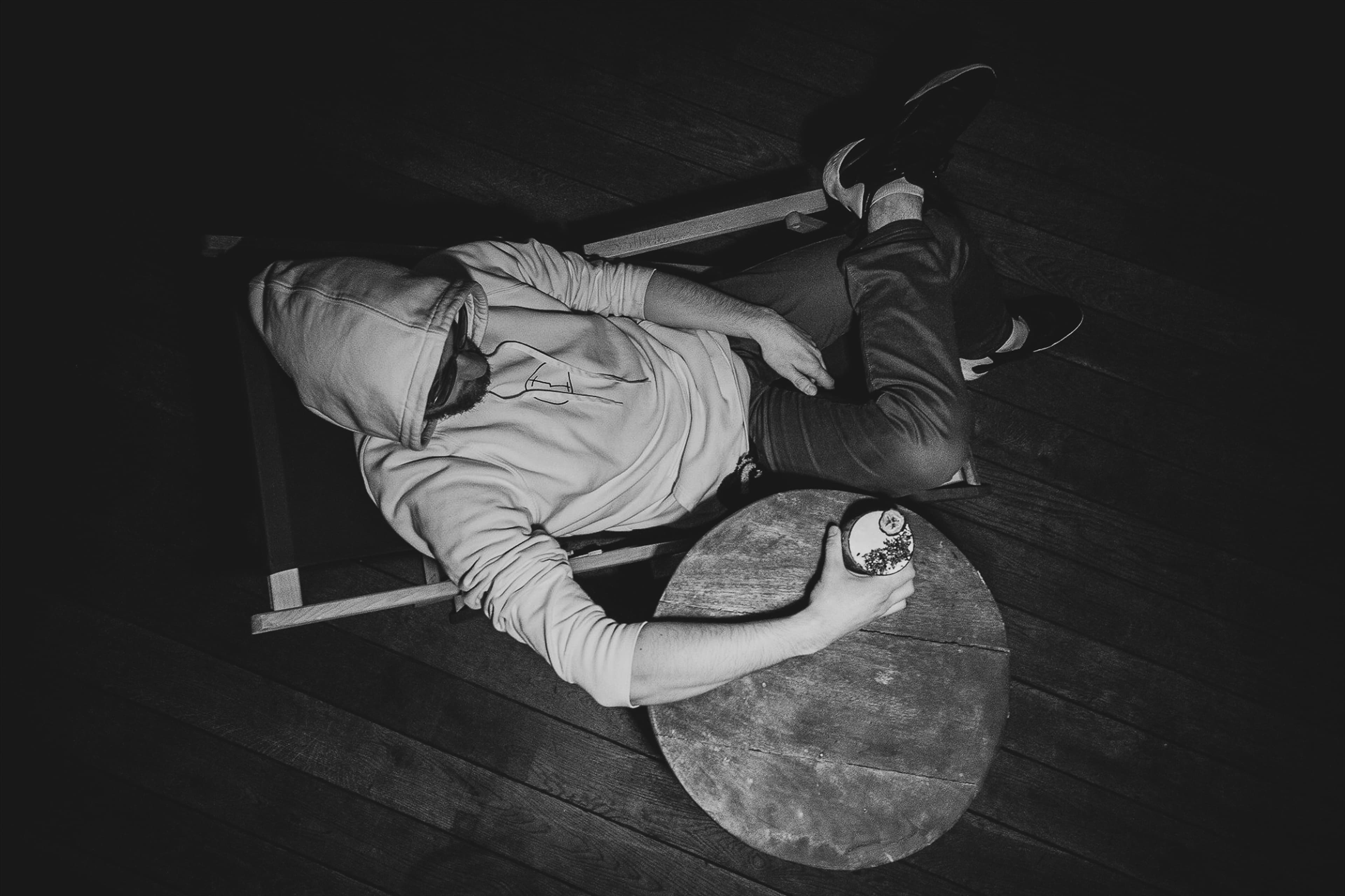Black and white overhead scene of a person at a table